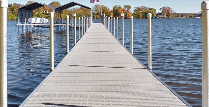 Long aluminum dock walkway leading to boat lifts in West Central Minnesota.